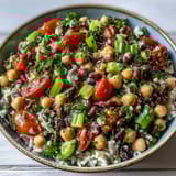 Vibrant New Years Hoppin John Salad with brown rice, red bell pepper, celery, and parsley, tossed in a light vinaigrette.