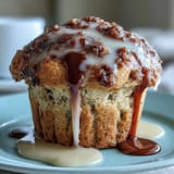 Bright lemon poppy seed muffins with a glossy lemon glaze, perfect for a fresh spring brunch spread.
