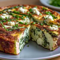 Spring Frittata with Asparagus, Peas and Goat Cheese - golden baked eggs with vibrant green vegetables and creamy goat cheese.